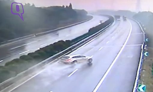 Video CCTV Captures Car Spinning Wildly on a Wet Highway
